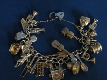 #0820 Silver Charm Bracelet - Music Themed - 24 Charms - circa 1965 **SOLD**